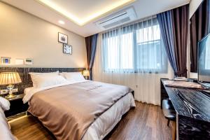 Postel nebo postele na pokoji v ubytování Seawater Spa Hotel Coza