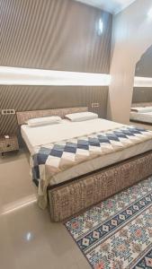 a bedroom with a bed and a rug on the floor at ZM Homestay live like locals and feel Indian culture and traditions in Tājganj