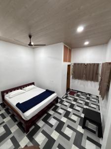 a bedroom with a bed in a room at Nature Stay in Gokarna