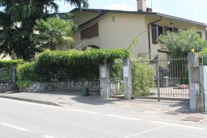 a fence in front of a house at B&B Artistic House in Cassano Magnago