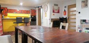 a dining room with a wooden table and chairs at Qvintesencia Terchová in Terchová
