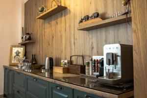 a kitchen with a counter with a coffee maker on it at The Art Boutique in Piatra Neamţ