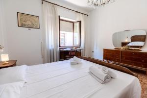 Ένα ή περισσότερα κρεβάτια σε δωμάτιο στο - Olbia City Center - Regina Margherita Apartment +49 φωτογραφίες