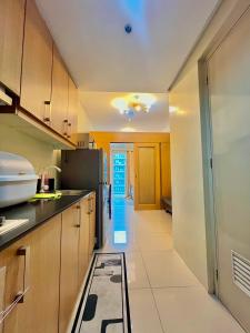 Kuchyň nebo kuchyňský kout v ubytování Shell Residences near MOA and NAIA by Mae