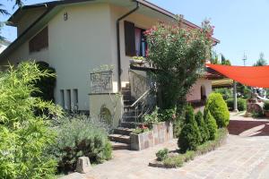 a house with a staircase in front of it at B&B Artistic House in Cassano Magnago