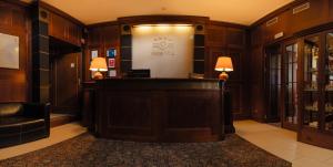 a lobby with a reception desk in a building at Hotel Villa in Prague