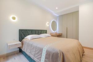 Ένα ή περισσότερα κρεβάτια σε δωμάτιο στο Simpsono Apartamentai +7 φωτογραφίες