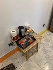 a coffee table in a corner of a room at NubaNest GuestHouse in Aswan