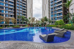 a swimming pool in the middle of a building at Aradia Lakecity with Totoro Muji Theme in Batu Caves Selayang, Kuala Lumpur by Nestaway in Kuala Lumpur