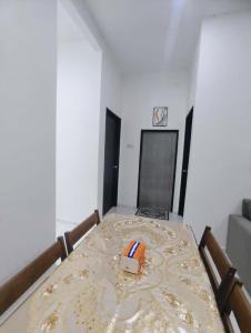 a room with a bed with a box on it at Homestay Triple S SAKINAH kangar in Kangar