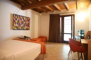 Katil atau katil-katil dalam bilik di Agriturismo Casari