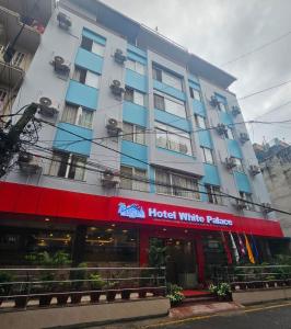 a hotel building with a hotel white palace at Hotel White Palace Airport Kathmandu in Pashupatināth