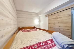 Ένα ή περισσότερα κρεβάτια σε δωμάτιο στο Charmant appartement au Revard Idéal pour 4 personnes au pied des pistes +6 φωτογραφίες