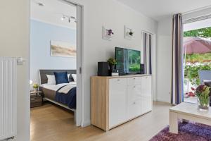 Postel nebo postele na pokoji v ubytování Residenz am Balmer See - BS 07 mit Wellnessbereich
