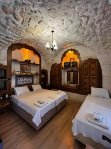シャンルウルファにあるTurkmen Konagiの石壁のドミトリールーム ベッド2台 +23枚の写真