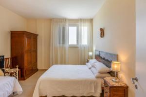 a bedroom with a large bed and a window at Villa La Quiete in Mogliano +41 photos