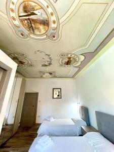 Postel nebo postele na pokoji v ubytování Sardinian Gallery Funtana + 5 fotografií