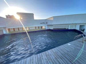 a swimming pool in front of a building at Seaview Comfort Apartment in Mombasa