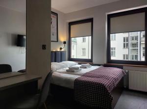 Ένα ή περισσότερα κρεβάτια σε δωμάτιο στο Atlantic Aparthotel