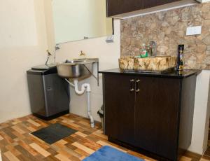 a bathroom with a sink and a sink at Lautoka Home away from Home in Lautoka +8 photos