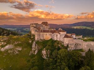 an old castle on top of a mountain at Le Nid des Pistes - Métabief Centre in Métabief
