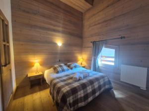Katil atau katil-katil dalam bilik di Superbe appartement 8pers - St Foy Station