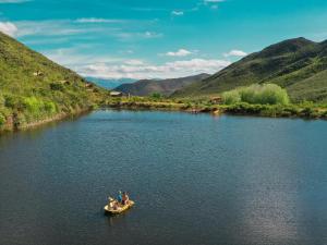 a group of people in a boat on a river at AfriCamps at Pat Busch in Robertson