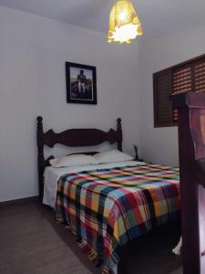 Ένα ή περισσότερα κρεβάτια σε δωμάτιο στο Serra da Capela