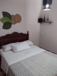 Ένα ή περισσότερα κρεβάτια σε δωμάτιο στο Serra da Capela