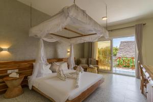 Postel nebo postele na pokoji v ubytování Kiwengwa Beach Resort