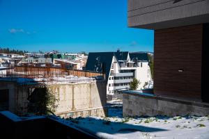 a view of the city from the roof of a building at Apartment Mima Bjelasnica in Bjelašnica