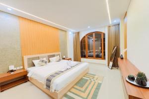 Ένα ή περισσότερα κρεβάτια σε δωμάτιο στο Slokayana Villas