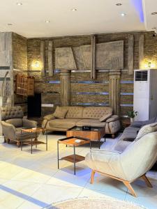 a living room with couches and tables at ملك دجلة - Malik Dijla in Baghdad