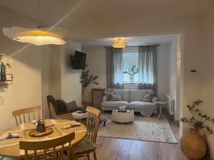 a living room with a table and a couch at 31 Lower English in Armagh