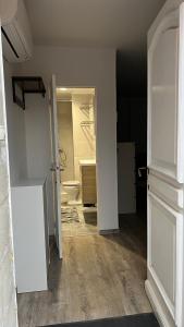 an empty room with an open door to a bathroom at Studio in a local home in La Fare-les-Oliviers