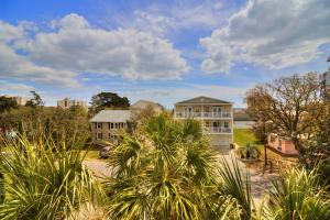 an aerial view of a house with palm trees at Stairway to Havens - South in Myrtle Beach