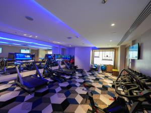 a gym with a bunch of exercise bikes in it at Casa Diora Hotel Al Rawdah in Jeddah
