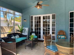 a living room with a couch and a table at Anna Maria Island-Blue Manatee in Bradenton