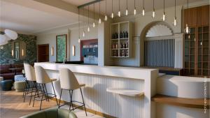 a bar in a restaurant with stools at Hotel 2M, The Originals Relais in Saint-Just-Saint-Rambert +2 photos