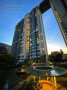 a view of a large apartment building at night at La Gente Comfy Stay 2r2b Velocity - Kl City View in Kuala Lumpur