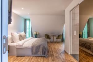 a bedroom with a bed and a table at Trip Inn Bermuda Zurich Hotel in Zurich +40 photos