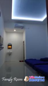 Postel nebo postele na pokoji v ubytování Villa Mutiara Sawarna