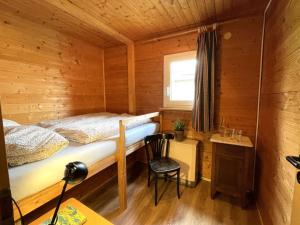 Ένα ή περισσότερα κρεβάτια σε δωμάτιο στο Chalet Alpenblick by Interhome +29 φωτογραφίες