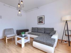 a living room with a couch and a chair at Apartment Katarina-1 by Interhome in Rabac