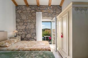 Ένα ή περισσότερα κρεβάτια σε δωμάτιο στο Casa Batana Vrsar