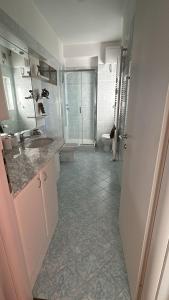 a bathroom with a sink and a toilet at Casa Bonomea in Trieste +12 photos