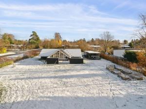 arial view of a house with a gravel driveway at Holiday Home Janik - 1-3km from the sea by Interhome in Græsted