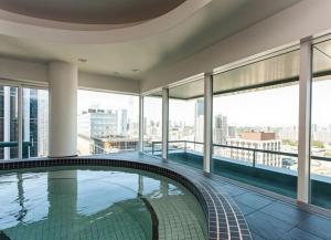 a swimming pool on the top of a building at Cambridge Suites Toronto in Toronto