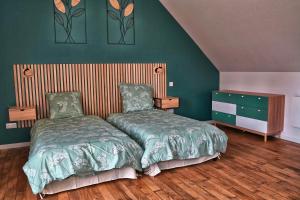 En eller flere senge i et værelse på Les clés du matz