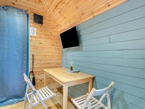 a small room with a table and two chairs at Boxing Hare - Uk39915 in Heckington